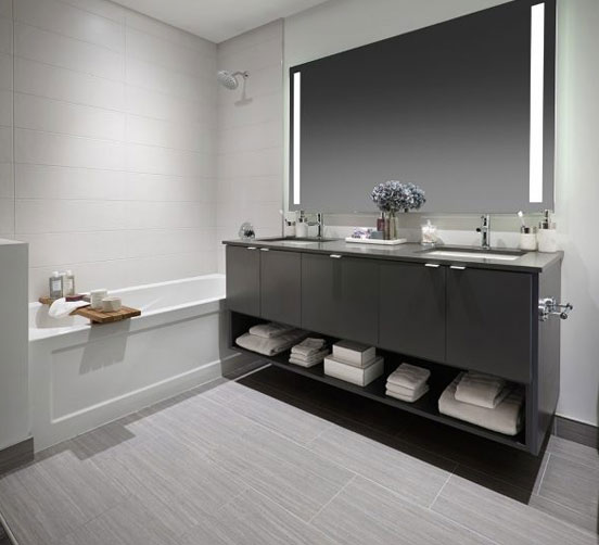 Modern bathroom with dual vanity counter and bath tub