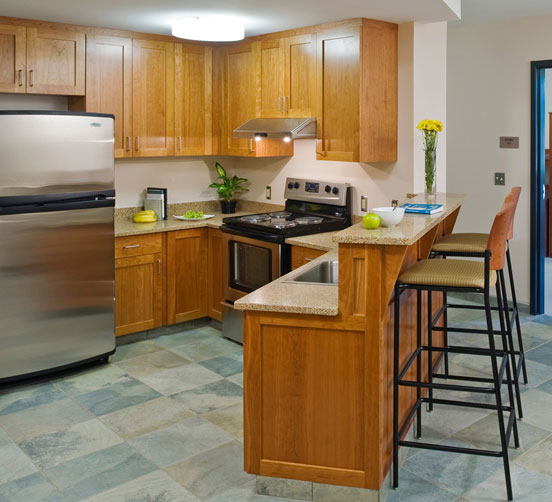Kitchen with stainless steel appliances and breakfast bar