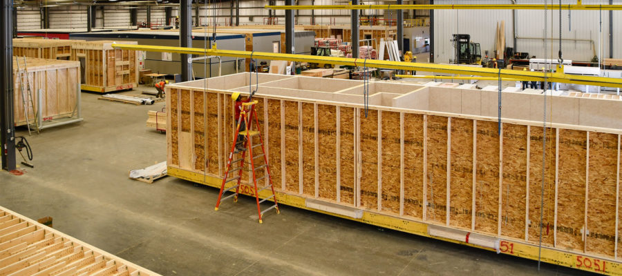 Modular structures being assembled in a warehouse