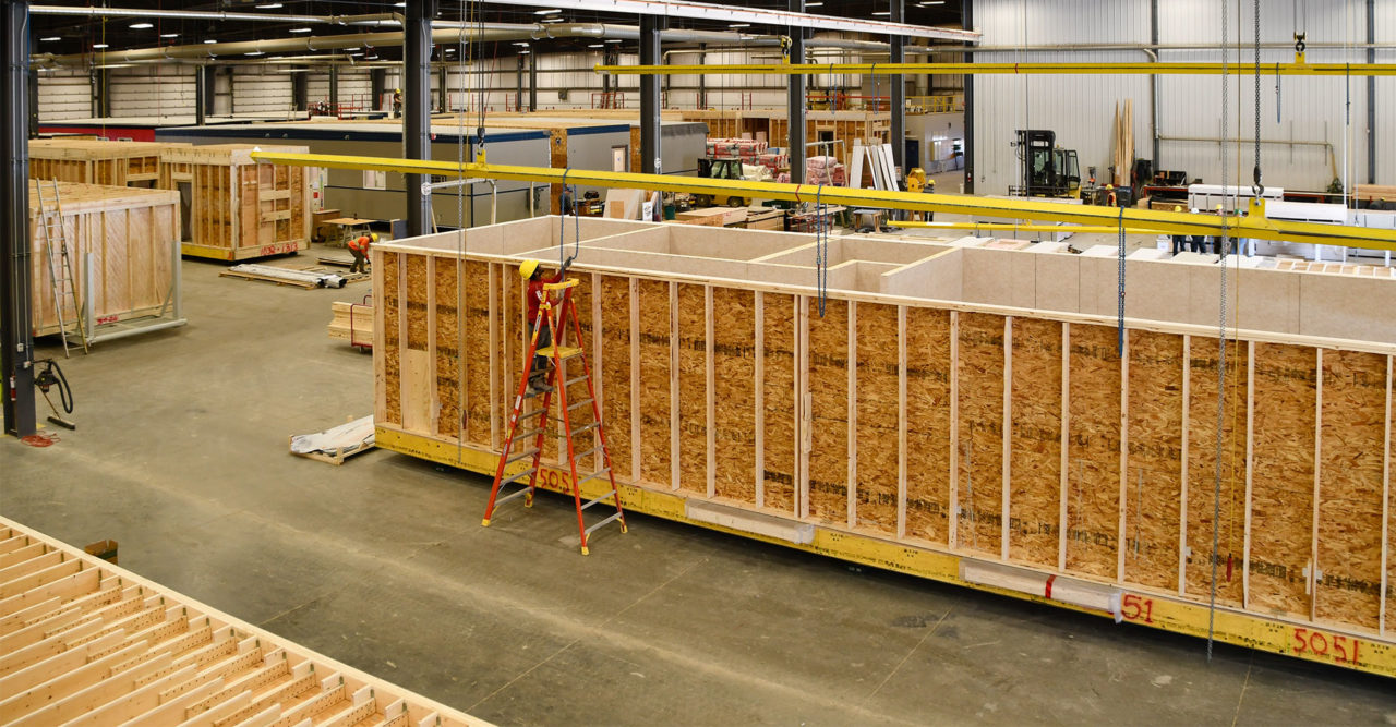 Modular structures being assembled in a warehouse